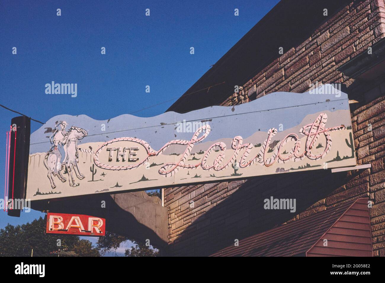 1980s America The Lariat Bar sign, Jackson, Nebraska 1980 Stock Photo