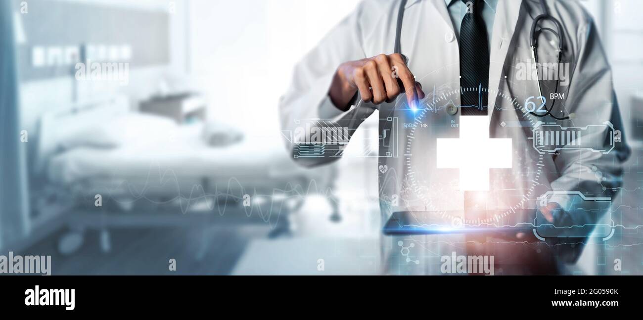 Technology Innovation and medicine concept, doctor medical using knowledge and modern virtual data try to recover the patient with covid-19 pandemic f Stock Photo