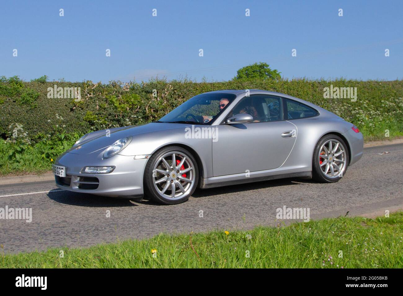2006 silver Porsche 911 Carrera 4 S 3824cc petrol coupe driving on country roads en-route to Capesthorne Hall, classic car show in Cheshire, UK Stock Photo - Alamy 2006 silver Porsche 911 Carrera 4 S 3824cc petrol coupe driving on country roads en-route to Capesthorne Hall, classic car show in Cheshire, UK Stock Photo - Alamy