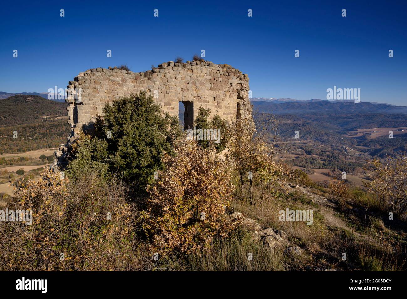 Views from the hill of the Lluçà castle with the castle ruins in the foreground (Osona, Barcelona, Catalonia, Spain) Stock Photo
