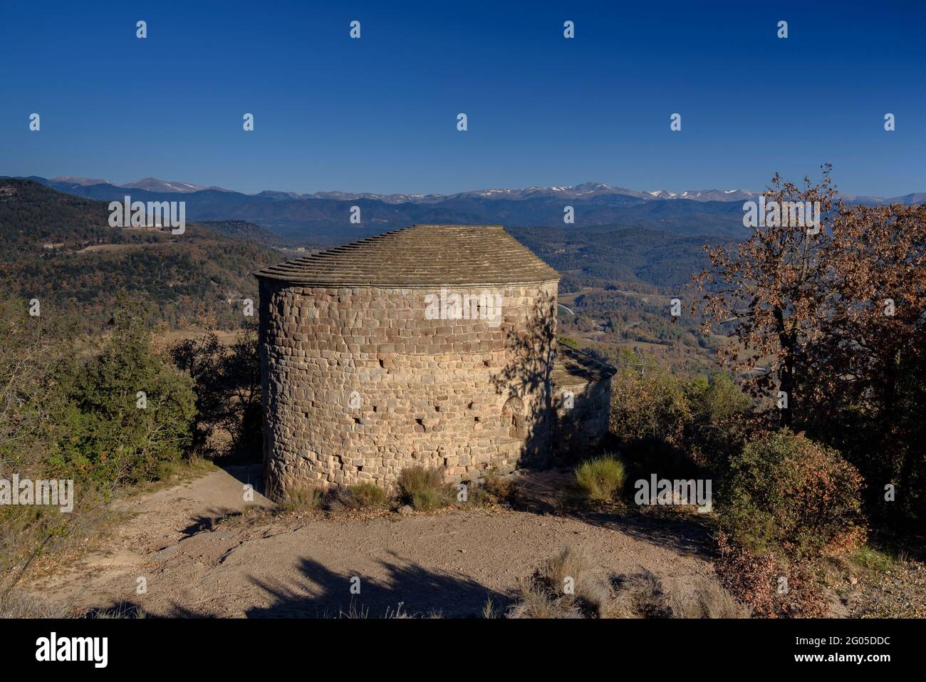 Views from the hill of the Lluçà castle with the Sant Vicenç de Lluçà hermitage in the foreground (Osona, Barcelona, Catalonia, Spain) Stock Photo