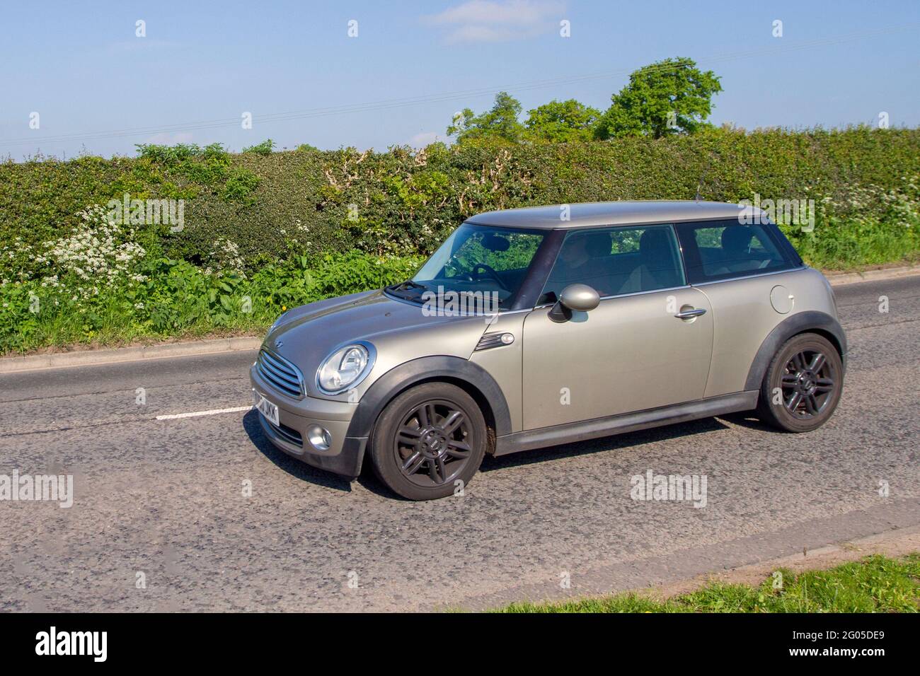 2010 Mini One Silver 1598cc petrol hatchback 2dr, Vehicular traffic, moving vehicles, cars, vehicle driving on UK roads, motors, motoring on the M6 motorway highway UK road network. Stock Photo