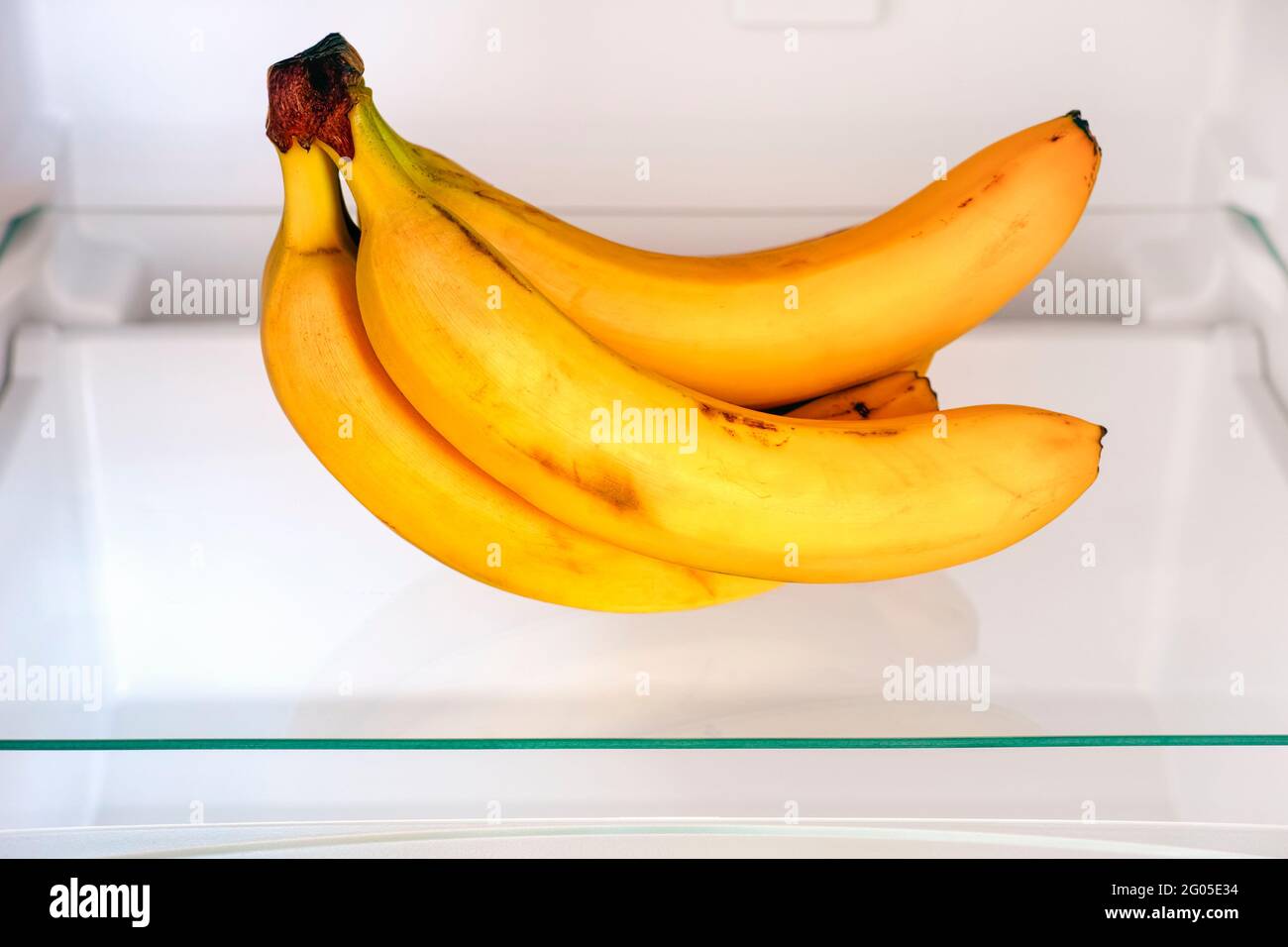A bunch of bananas on shelf in fridge. Close up Stock Photo Alamy