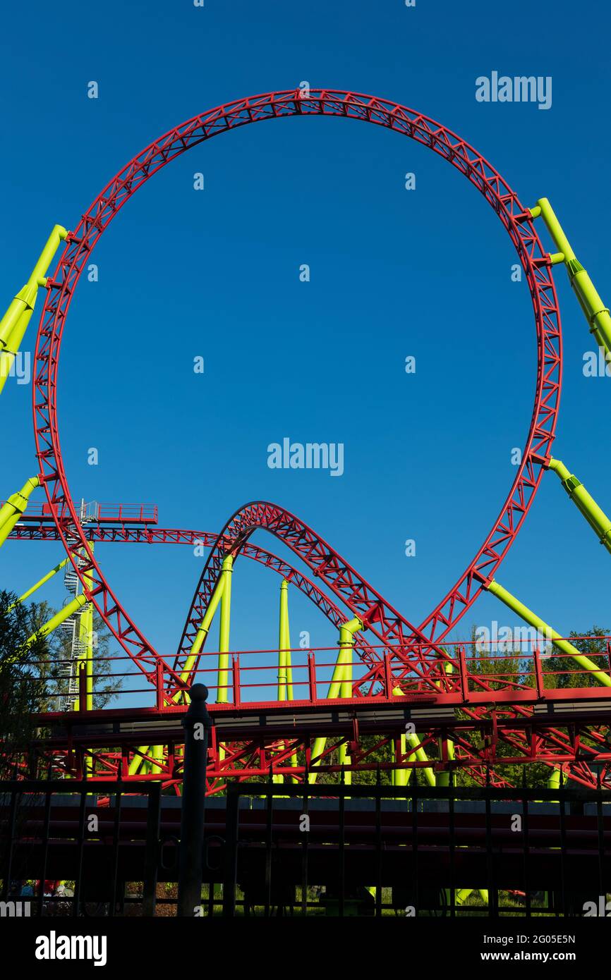 Vertical shot with a roller coaster loop on a blue sky background closeup Stock Photo