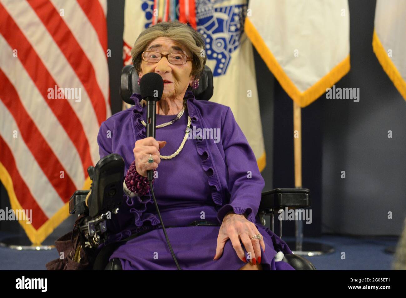 Reportage:   World War II Army veteran 106-year-old Alyce Dixon talks about her experiences as a member of the Women's Army Corps, during a women's history month event at the Pentagon, March 31, 2014. Dixon was honored with a Department of the Army Lifetime Achievement Women of Character, Courage and Commitment award, and a Women's History Month certificate of appreciation. During World War II, Dixon served in Europe as a member of the 6888th Central Postal Directory Battalion. The 6888th was the only unit of African-American women in the WAC to serve overseas in England and France during Worl Stock Photo