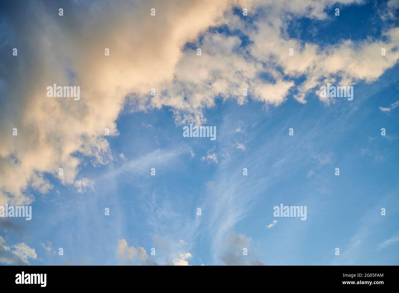 Blue sky at sunset with dramatics clouds Stock Photo