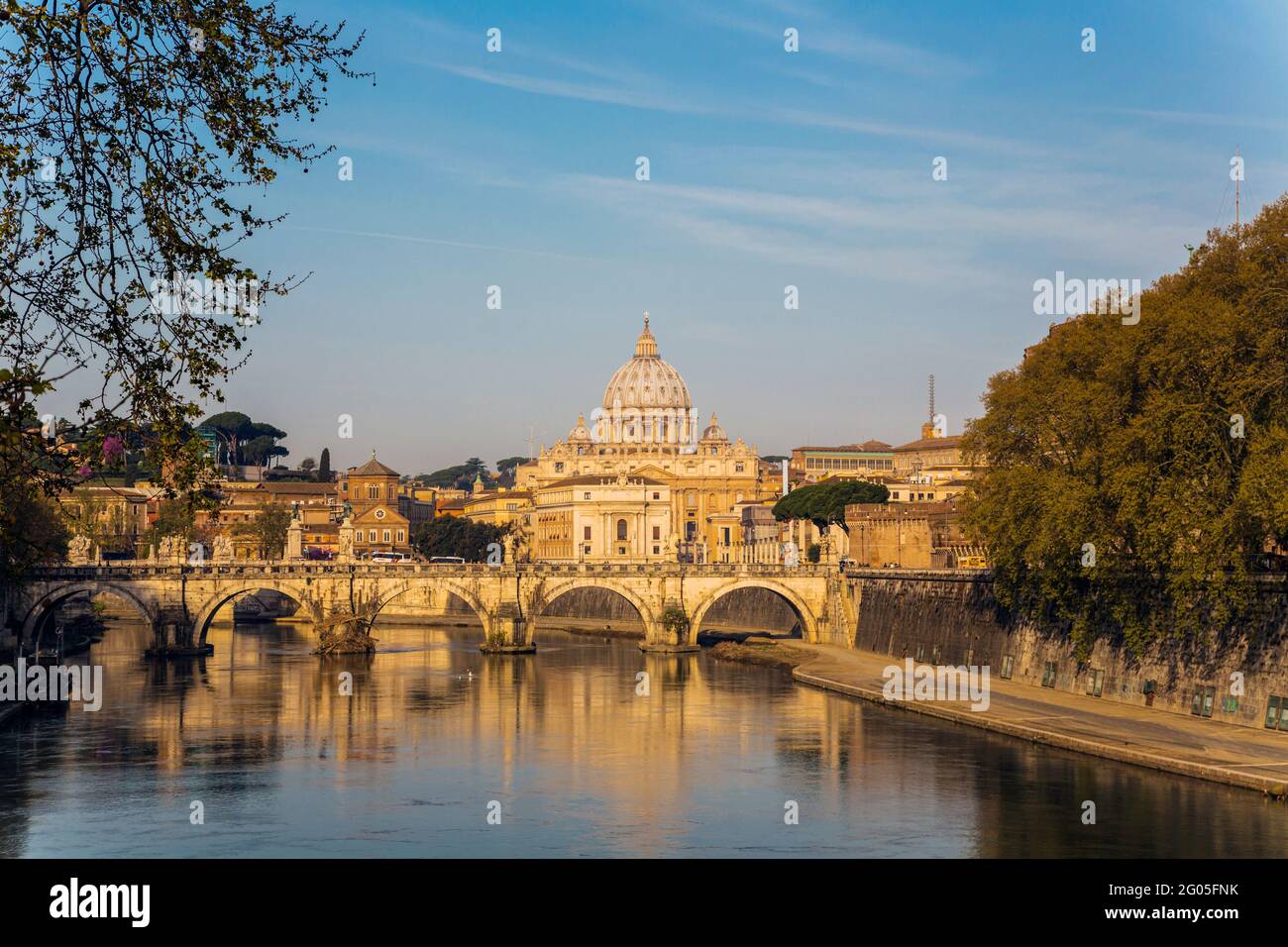 Rome, Italy.  St Peter's Basilica. Tiber river and Sant'Angelo Bridge in foreground.  The historic centre of Rome is a UNESCO World Heritage Site. Stock Photo