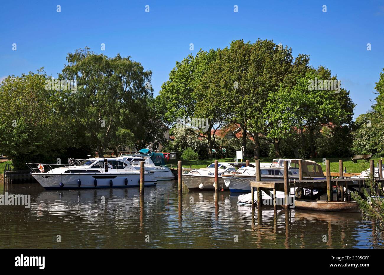 A Broads cruiser reversing into a mooring space at Rockland Staithe on the Norfolk Broads at Rockland St Mary, Norfolk, England, United Kingdom. Stock Photo