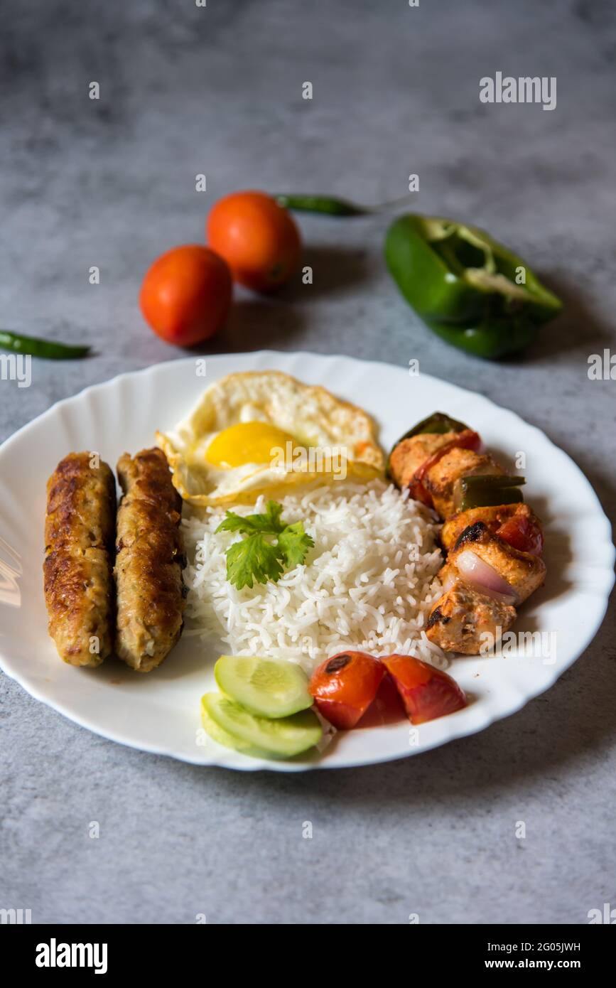 Middle eastern dish chelo kebab made of lamb kebabs that are grilled