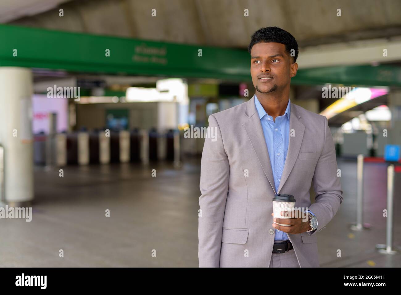 Portrait of handsome young African businessman wearing suit Stock Photo ...