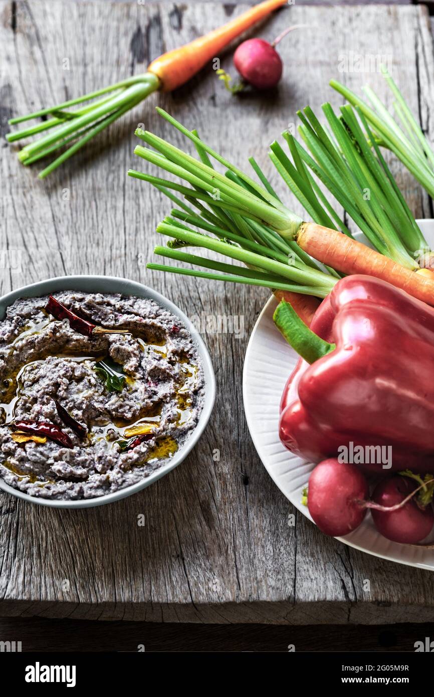 Homemade Black Bean Dip with Hebs Olive Oil ,Dried Chili by fresh vegetable Stock Photo