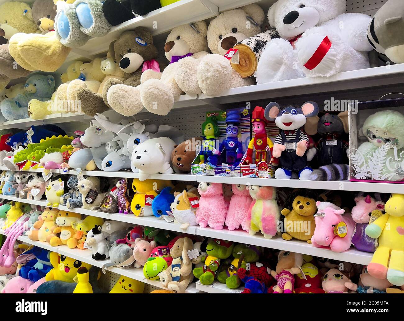 Sevastopol, Crimea - May 7, 2021: Shelves in store with soft children's toys of various manufacturers. Stock Photo