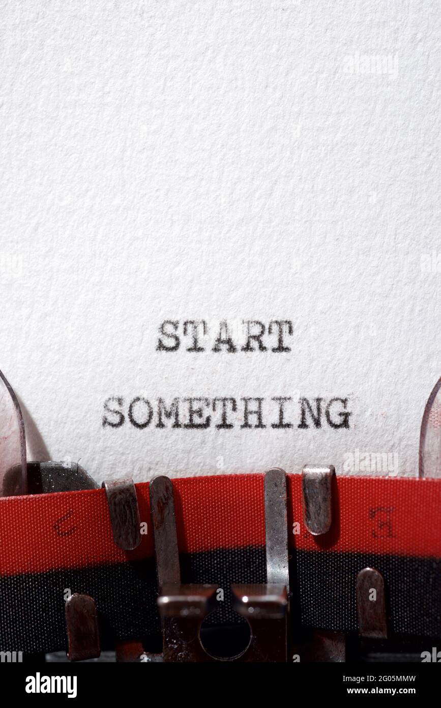 Start something phrase written with a typewriter Stock Photo Alamy
