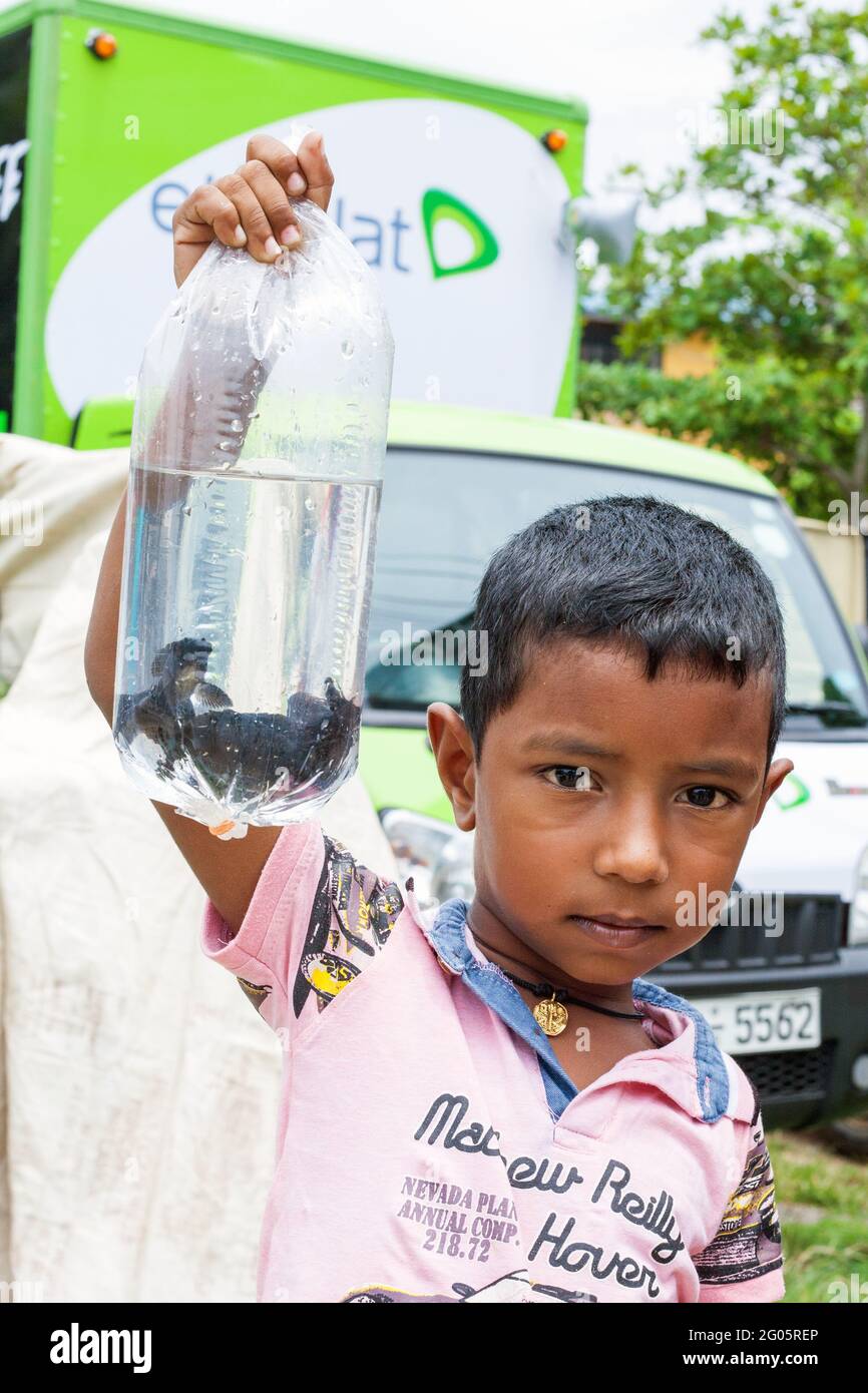Child holding small bag hires stock photography and images Alamy