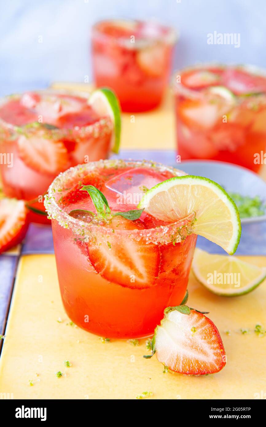 Ice Cold Cocktail With Fresh Strawberries And Lime Stock Photo