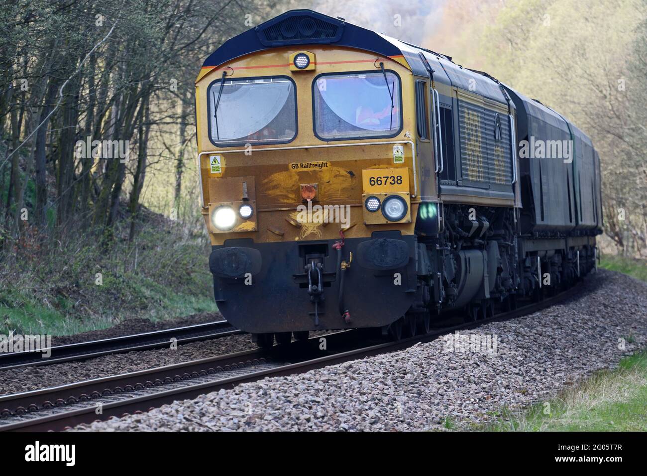 GBRf Class 66 diesel engine 66738, Huddersfield Town,  hauling wood pellets to Drax power station Stock Photo