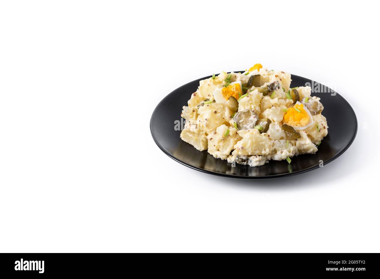 Potato salad with gherkings, egg and mustard isolated on white