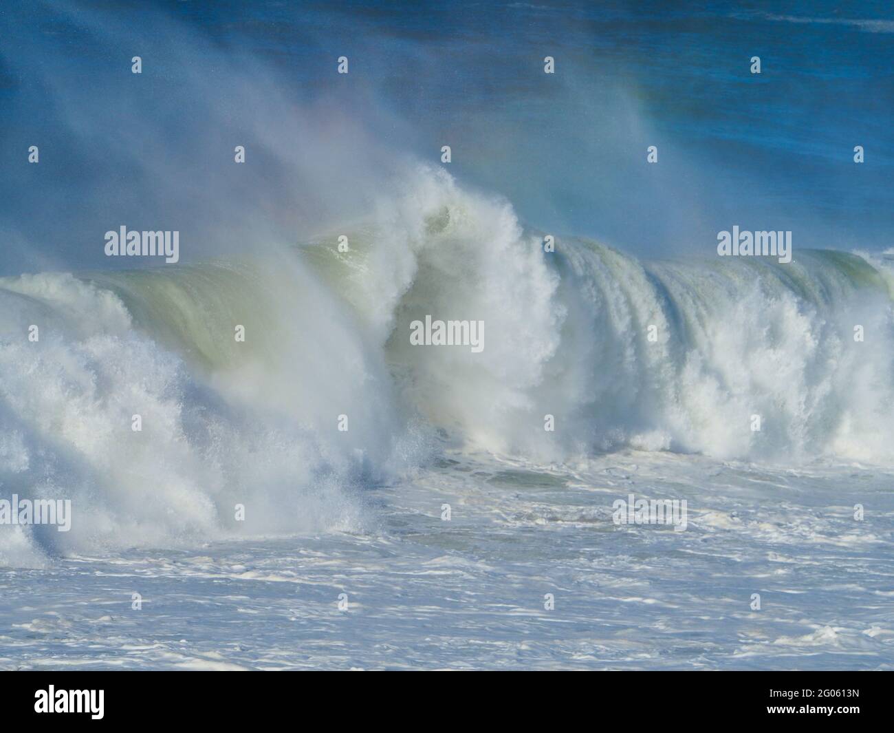 Amazing frothy foamy white waves breaking, with a touch of rainbow in ...