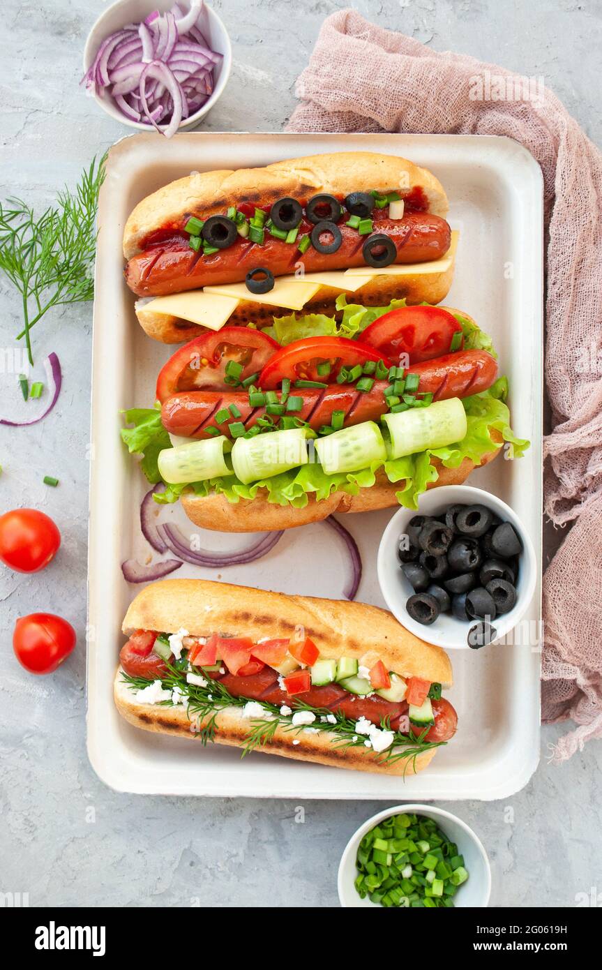 Delicious freshly cooked hot dogs fully loaded with assorted toppings