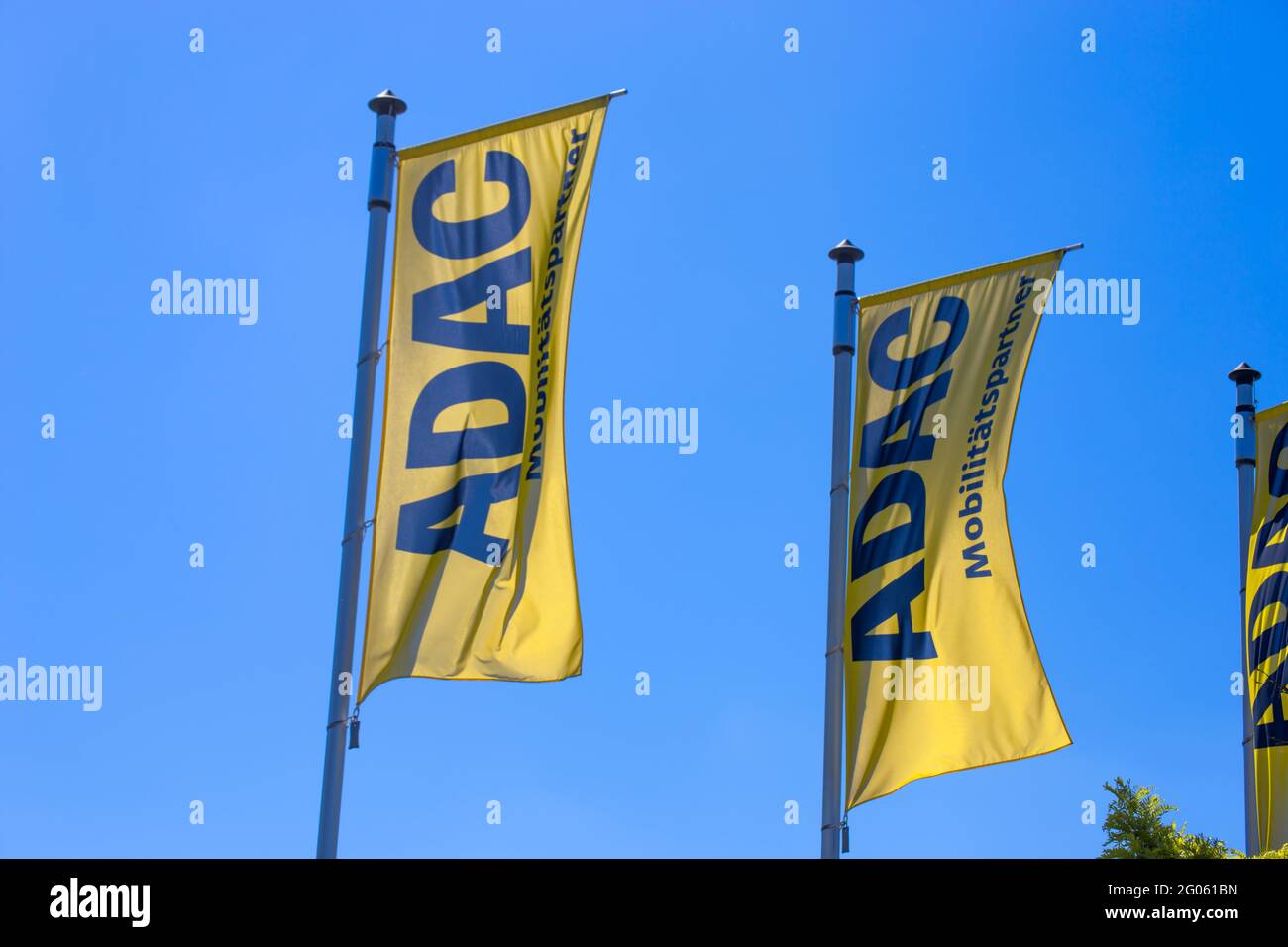 ADAC flags against a blue sky Stock Photo