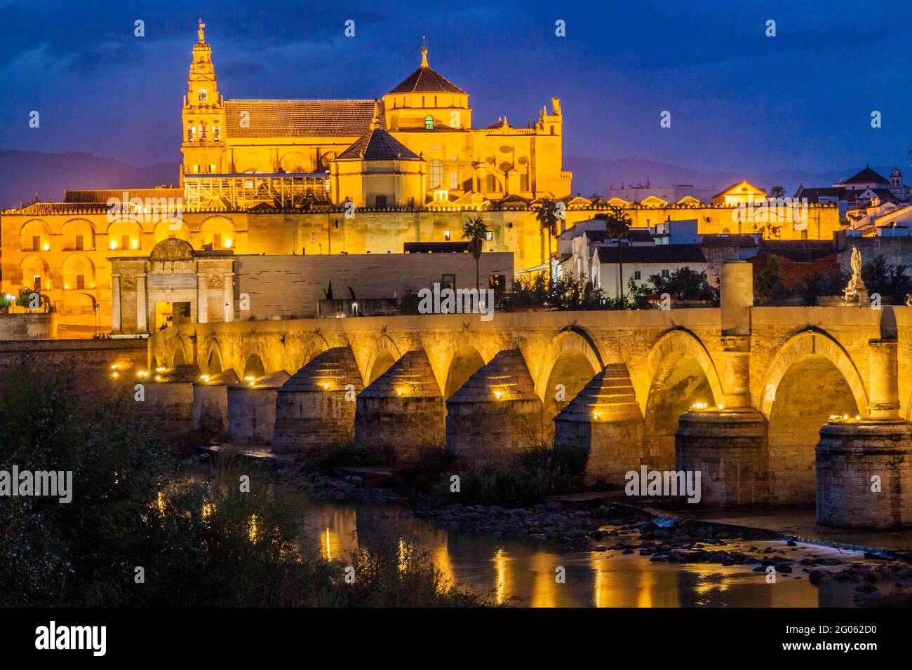 Evening view of the Mosque-Cathedral and Roman Bridge in Cordoba, Spain Stock Photo