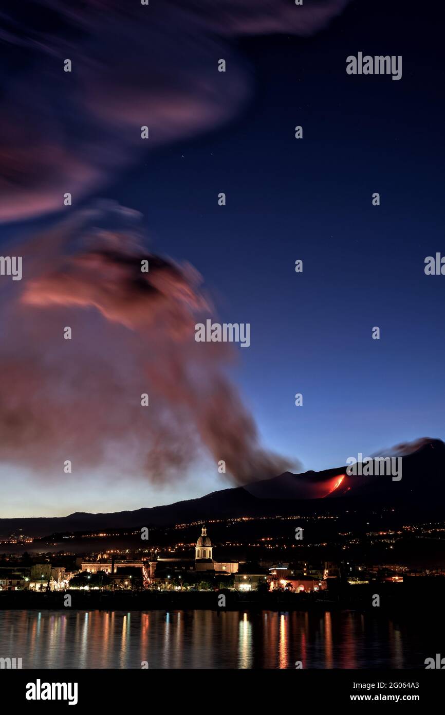 Night eruption of Etna volcano seen from giarre riposto village, Etna National Park, UNESCO, World Heritage Site, Sicily, Italy, Europe Stock Photo