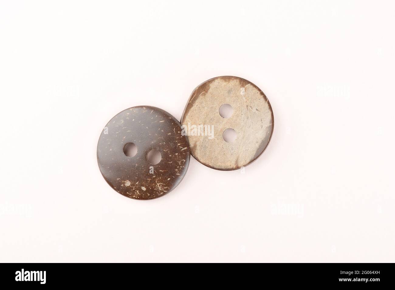 Two brown marbled plastic buttons on both sides. Close up. Copy space. Stock Photo