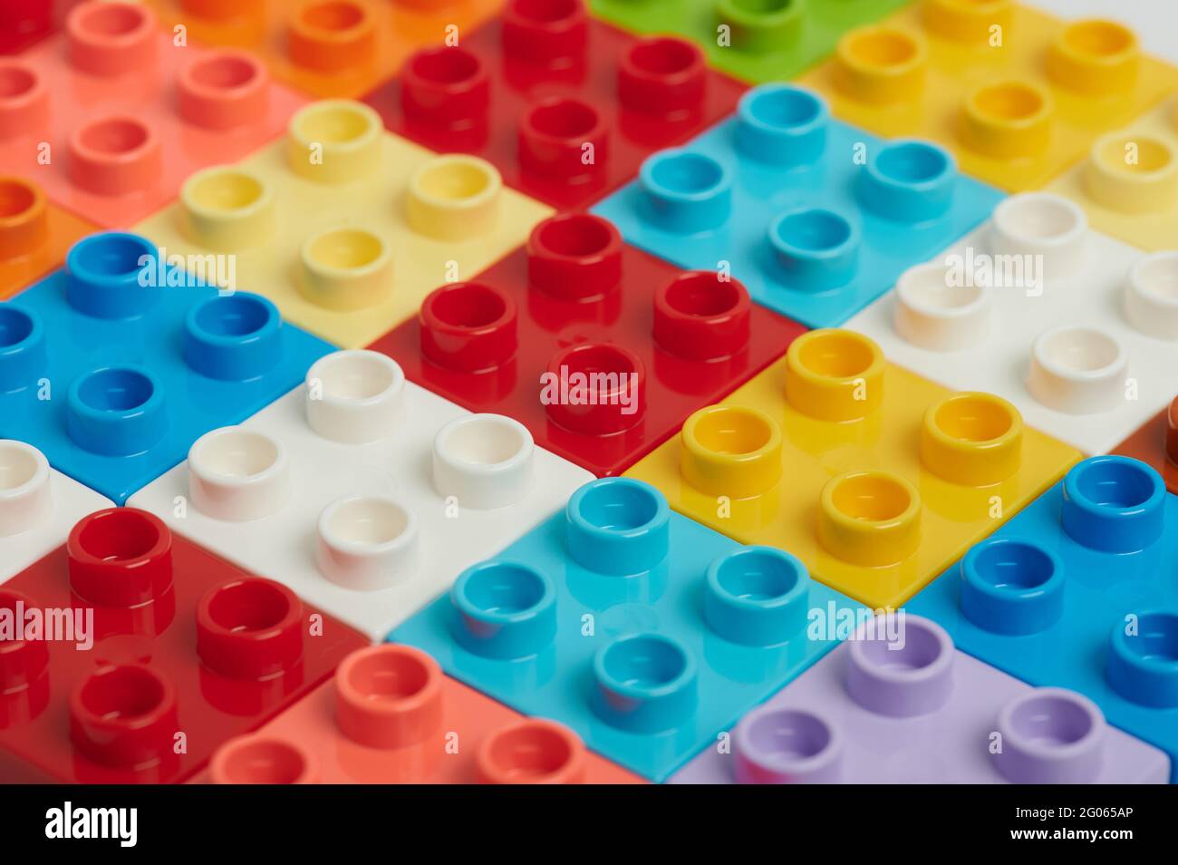 Set of colorful plastic bricks background close up view Stock Photo