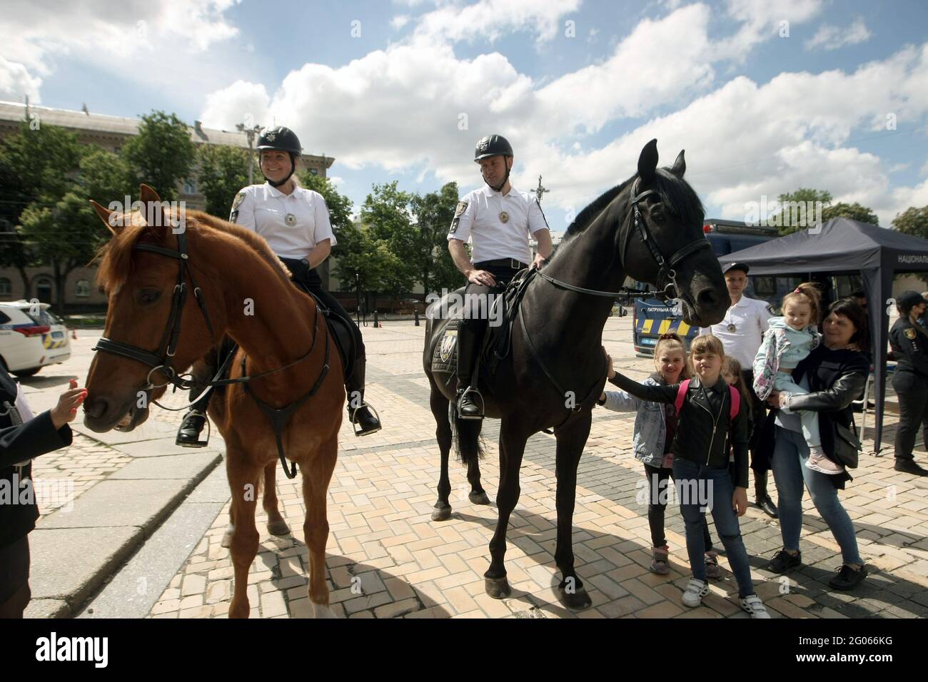 KYIV, UKRAINE - JUNE 1, 2021 - Mounted police officers visit the celebration of International Children’s Day in Sofiiska Square, Kyiv, capital of Ukra Stock Photo