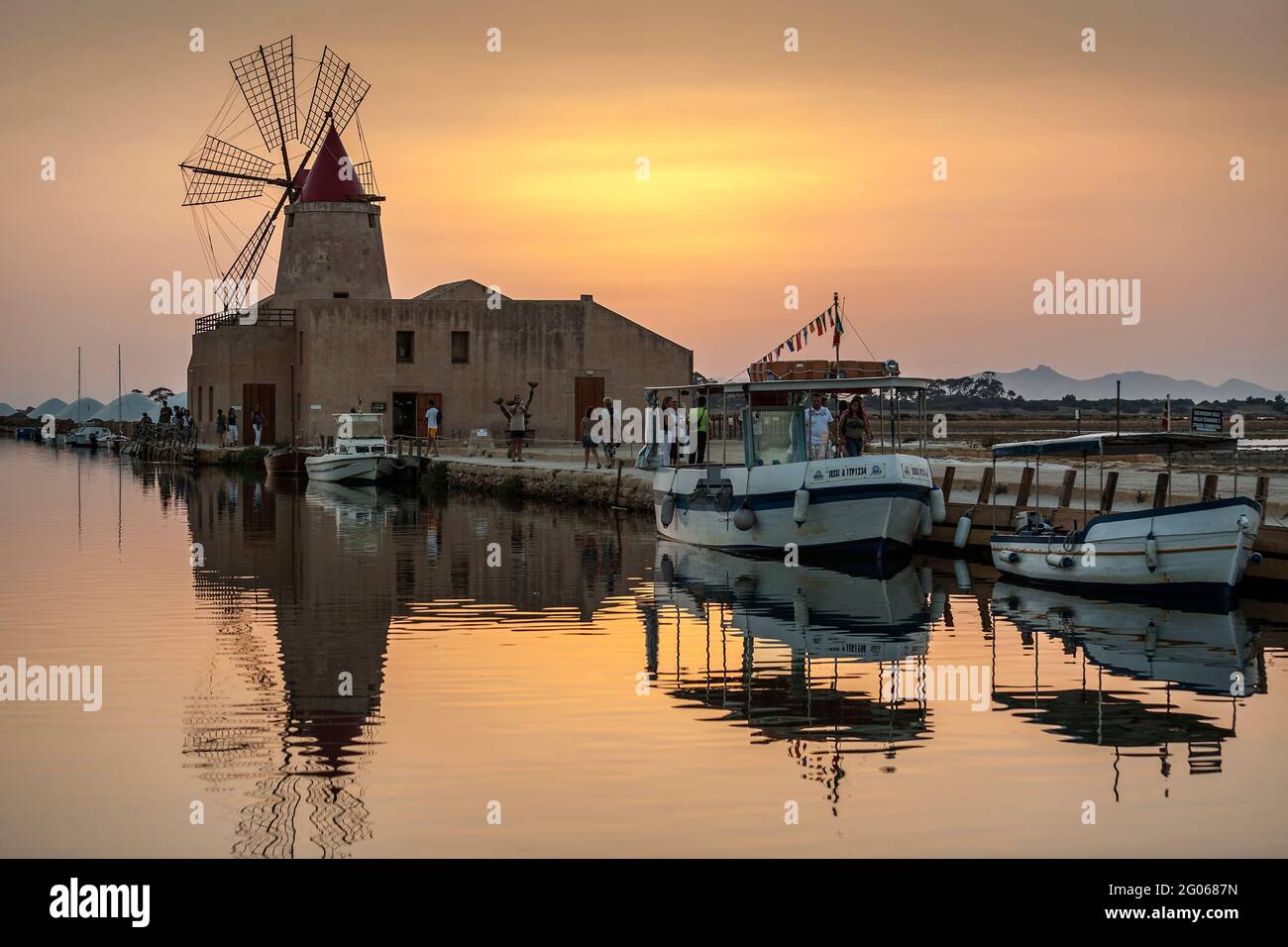 Saltworks,  Saline of Trapani, sunset, salt museum, salt, windmill, nature reserve, Stagnone of Marsala, Sicily, Italy, Europe Stock Photo