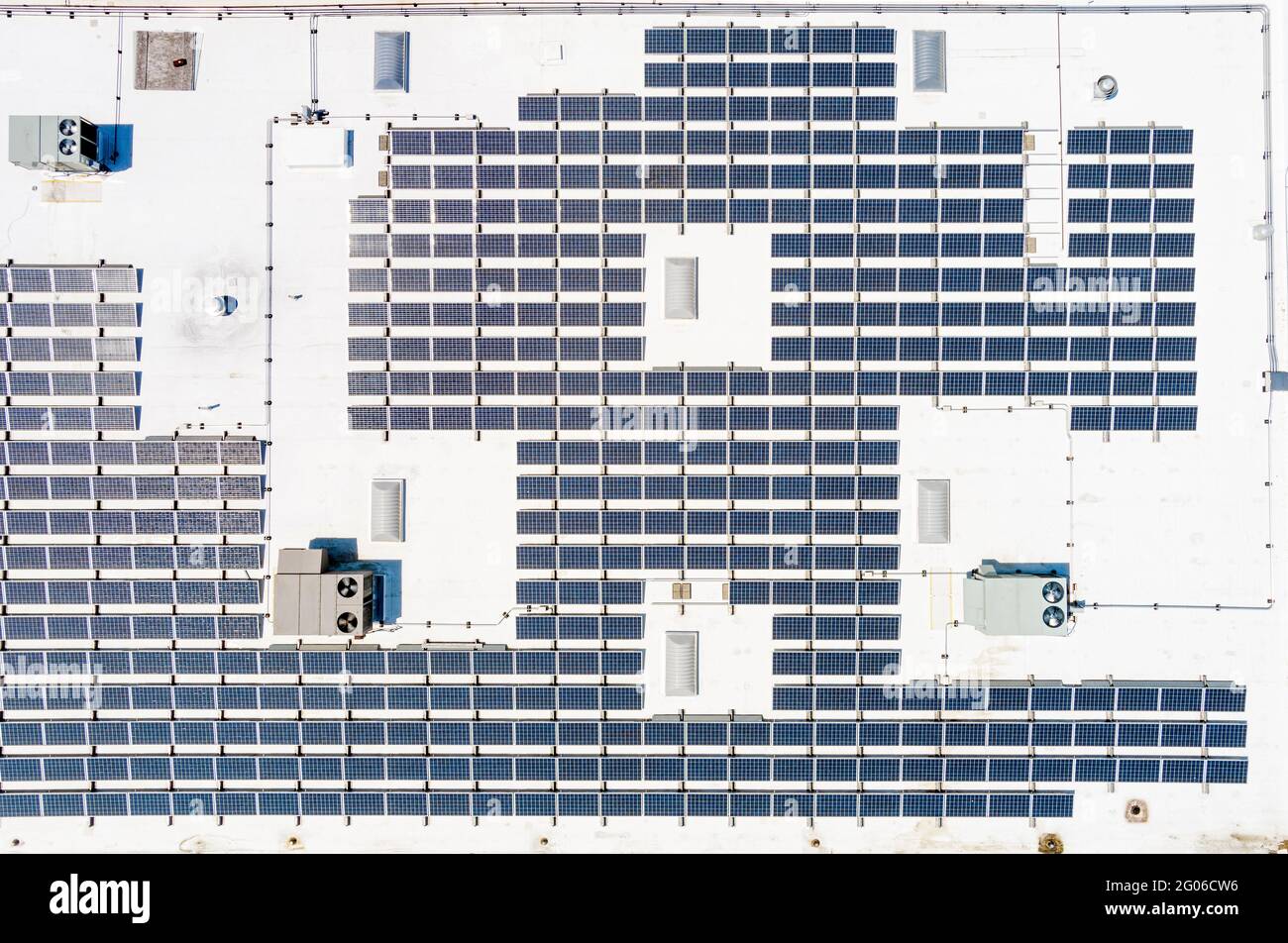 Aerial view of solar panels on roof of commercial building Stock Photo