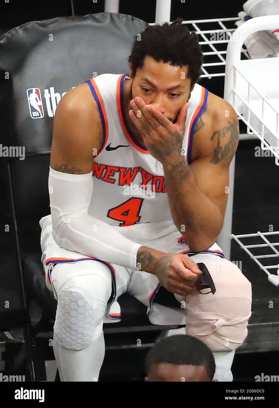 New York Knicks guard Derrick Rose sits on the bench with his knee ...