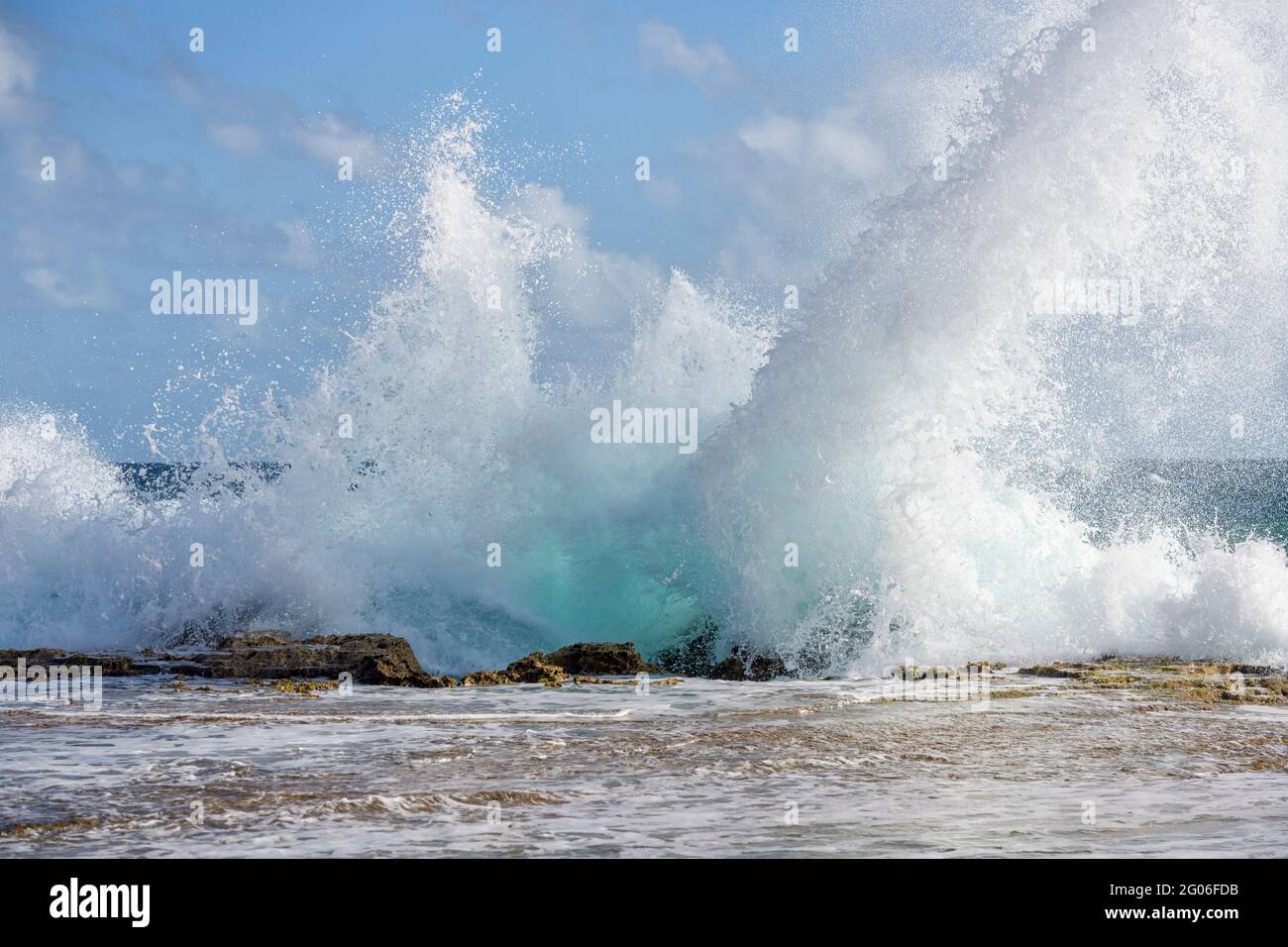 Typical wild coastline of Bonaire, Dutch Caribbean, with waves crushing on rocks. Stock Photo