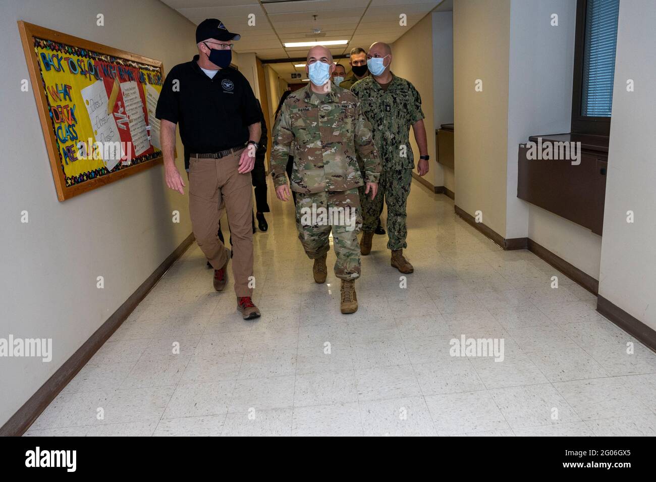 Reportage:  Acting Defense Secretary Chris Miller walks with the director of the Walter Reed National Military Medical Center, Army Col. Andrew Barr, before getting a COVID-19 vaccination at the medical center, Bethesda, Md., Dec. 14, 2020 Stock Photo