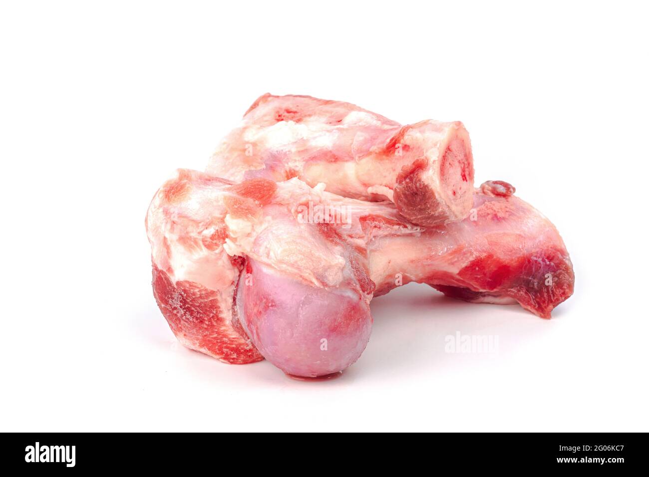 Close up frozen fresh pork bones with red meat stuck To be used for making pork bone broth on a