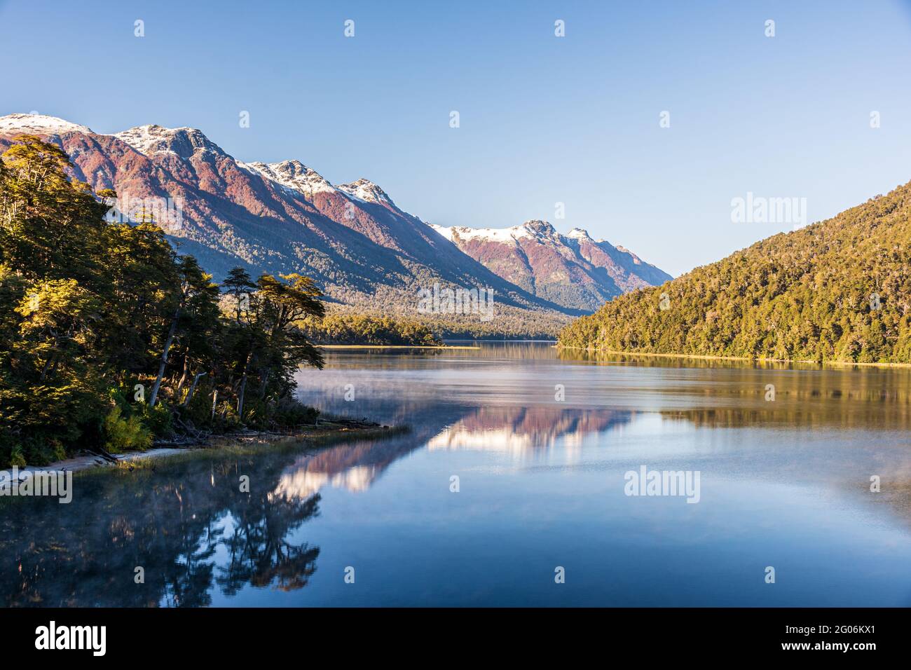 Beautiful shot of the Lago Moreno lake near trees in Nahuel Huapi National Park, Argentina Stock Photo