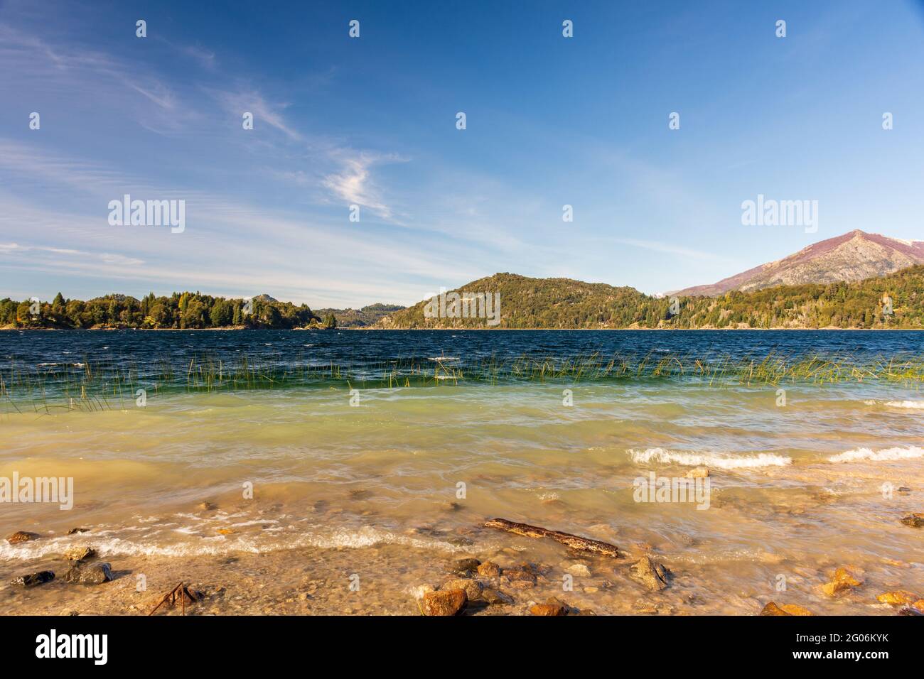Beautiful shot of the Lago Moreno lake near trees in Nahuel Huapi National Park, Argentina Stock Photo