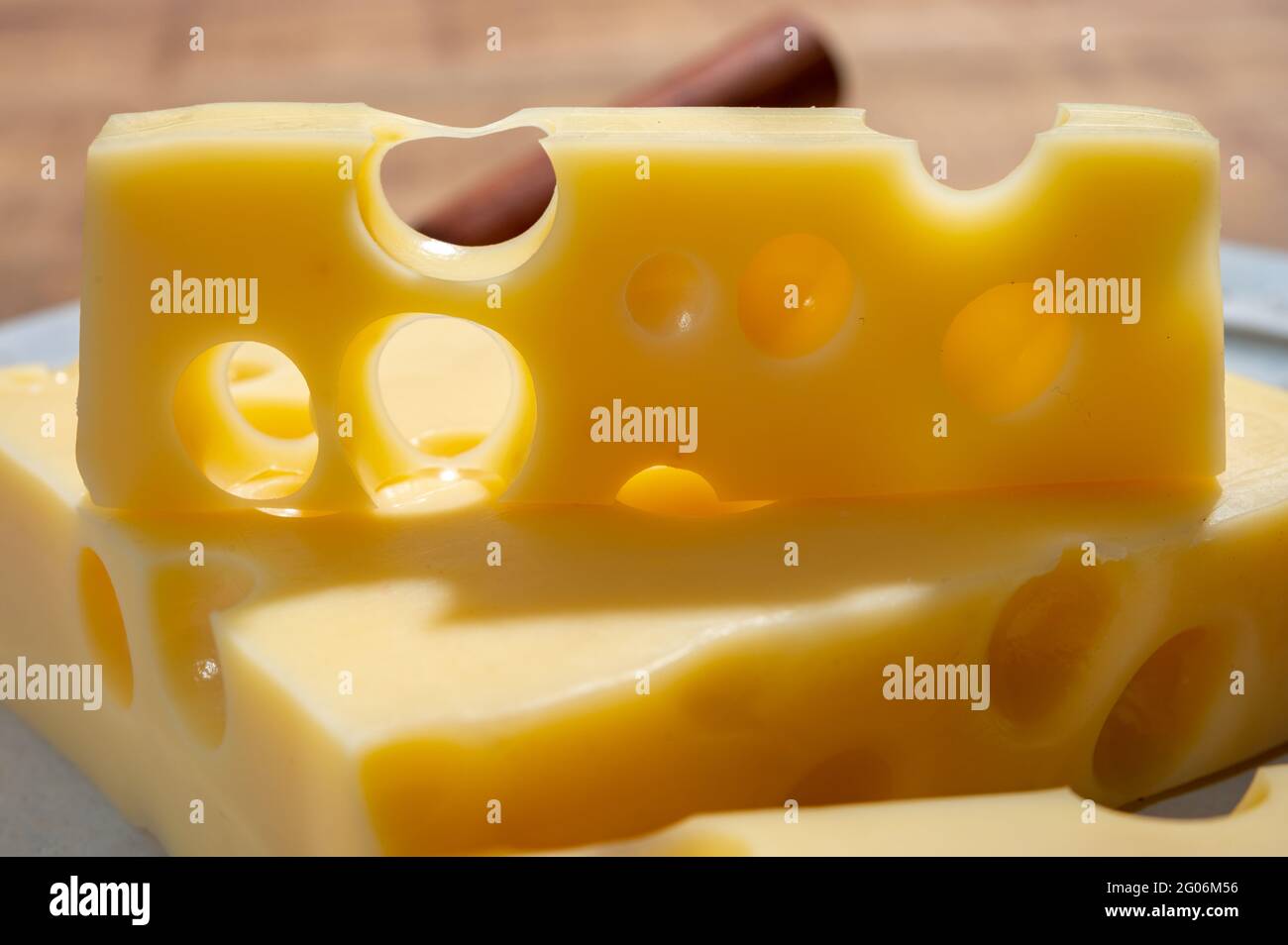 Cheese collection, blocks of French emmentaler cheese with many round