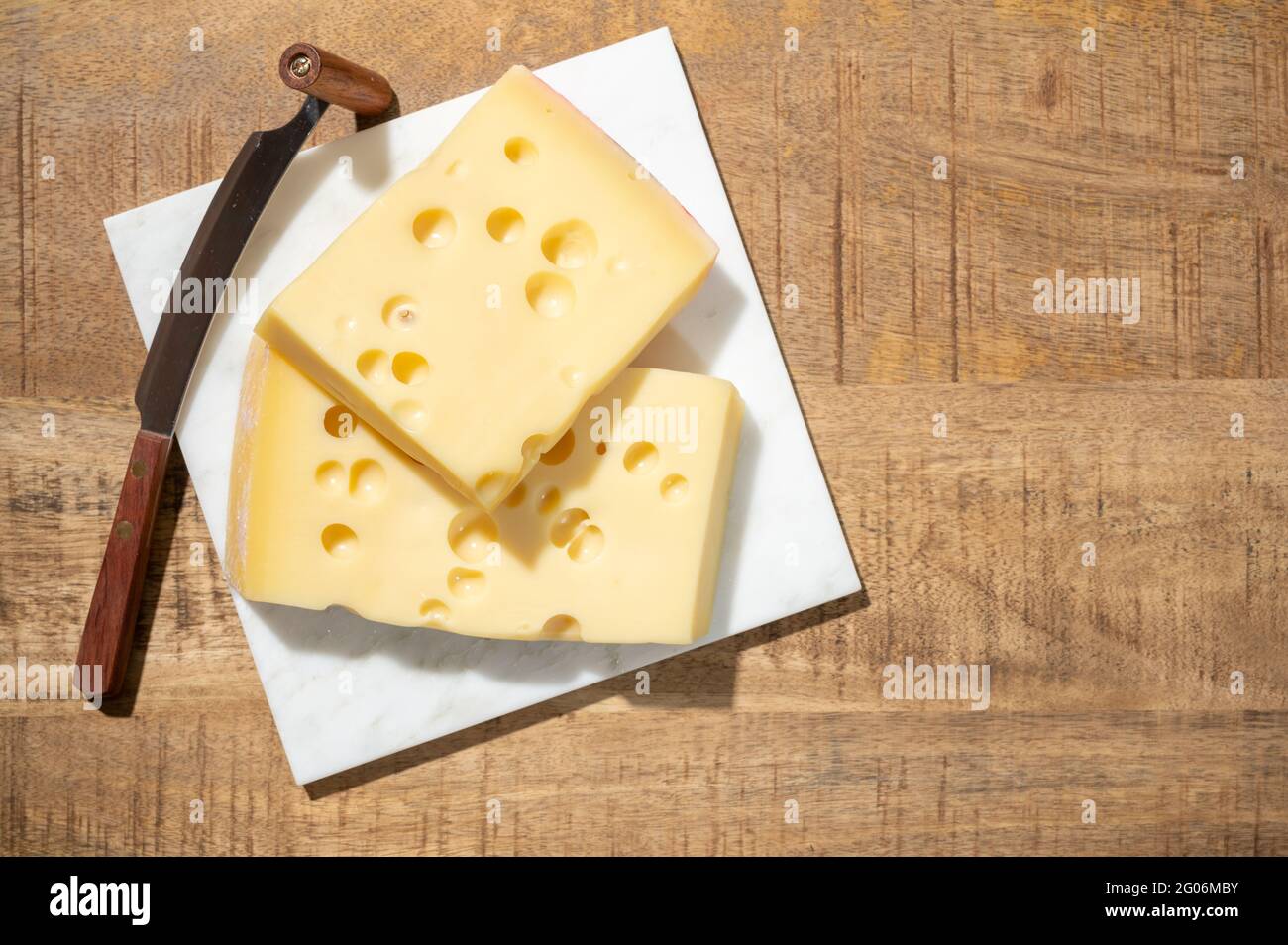 Cheese collection, blocks of French emmentaler cheese with many round