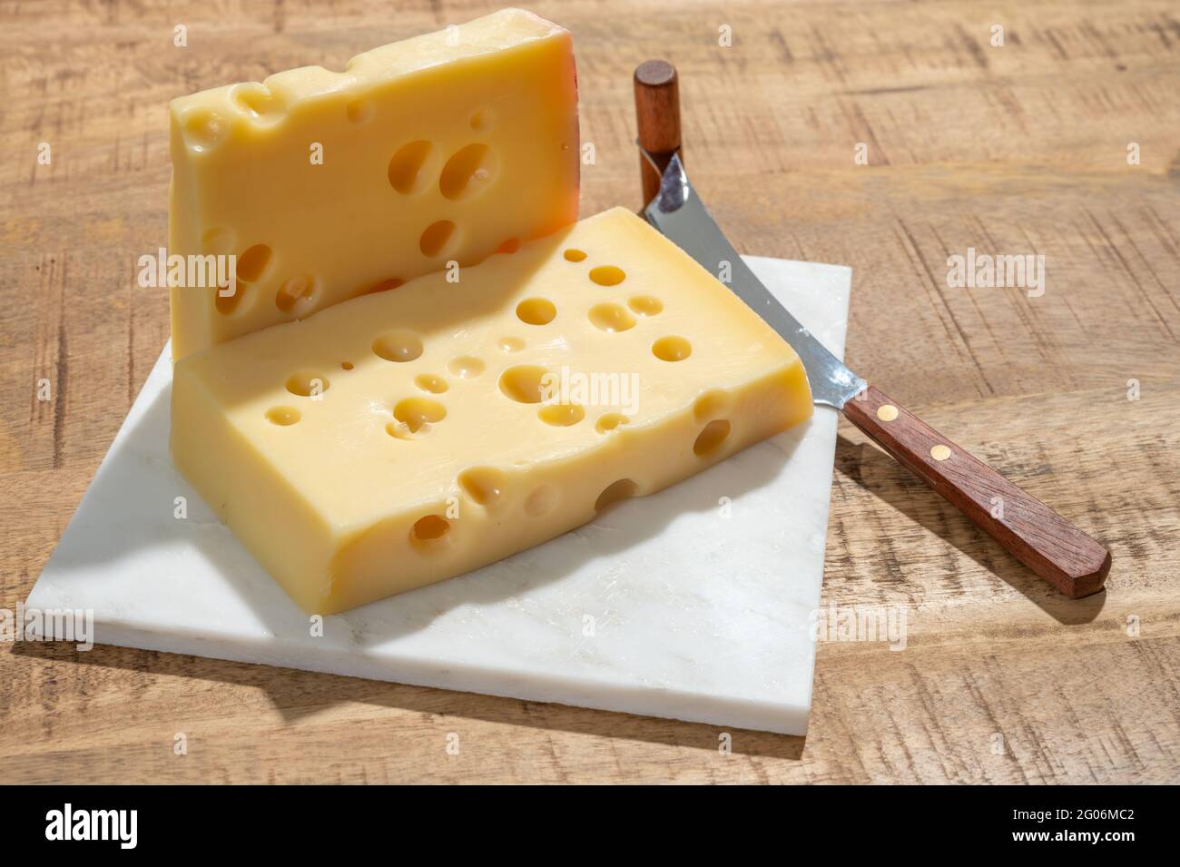 Cheese collection, blocks of French emmentaler cheese with many round