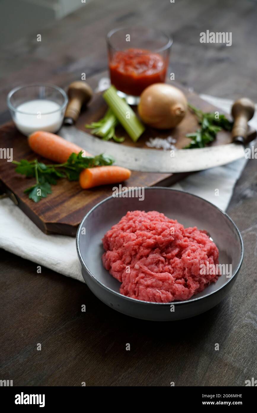 Ingredients for the preparation of meat bolognese ragout, ground beef, pork, thick tomato sauce