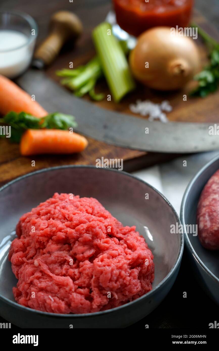 Ingredients for the preparation of meat bolognese ragout, ground beef, pork, thick tomato sauce