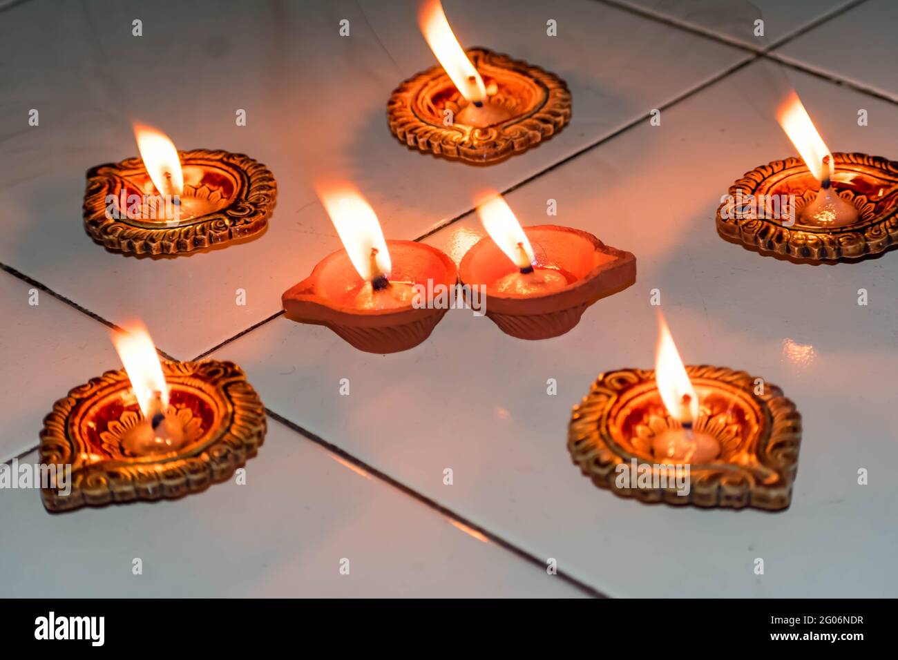 oil lamp or Diwali Diya also known as diva made of clay glowing decoration  in diwali festival in front of flat. Diwali is biggest festival of India  Stock Photo - Alamy