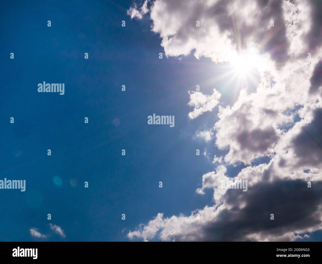 Sun rays coming out of the clouds Stock Photo