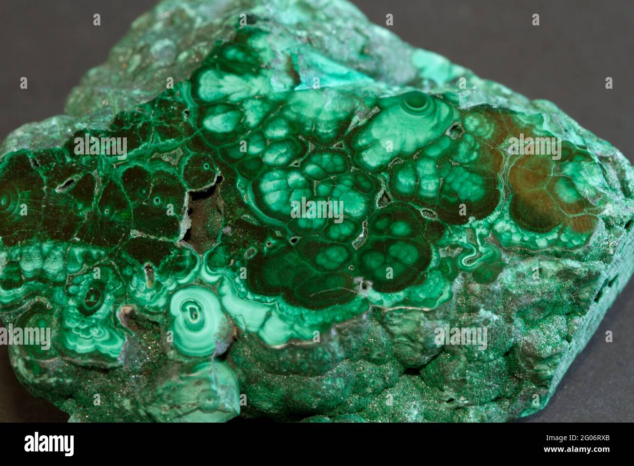 Malachite is an ore of Copper Carbonate that has been mined since ancient times. It is prized for the copper smelted that started the Bronze Age Stock Photo