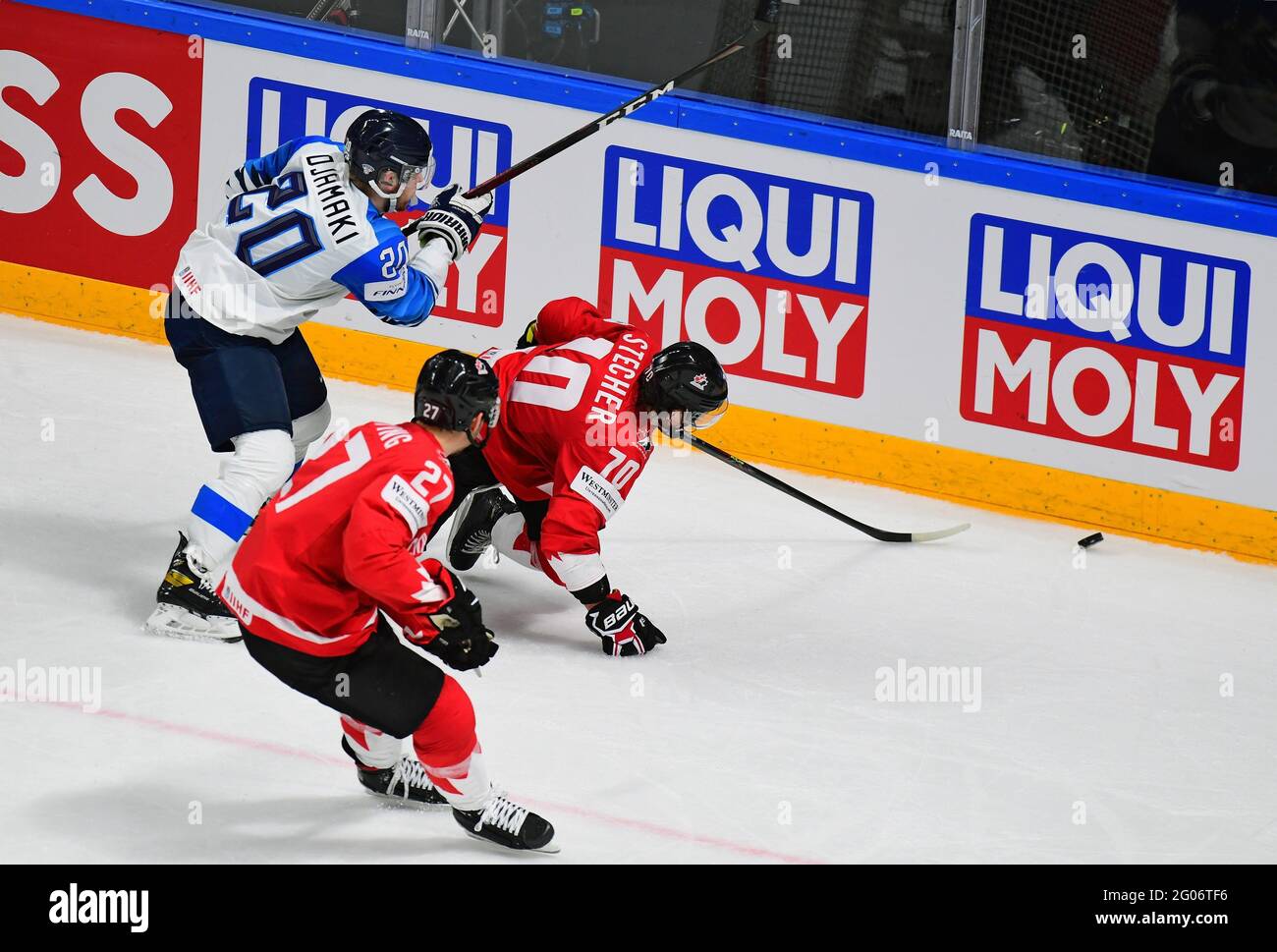Ice Hockey World Championship 2021. Finland vs Canada at the Arena Riga  stadium. Left to right: Finland's Niko Ojamaki, Canada's Michael Bunting  and Troy Stecher during a match. June 01, 2021. Latvia,