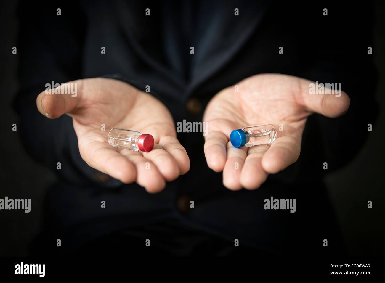 red ampoule and blue ampoule. The right choice the concept of the movie matrix. choosing the best vaccine Stock Photo