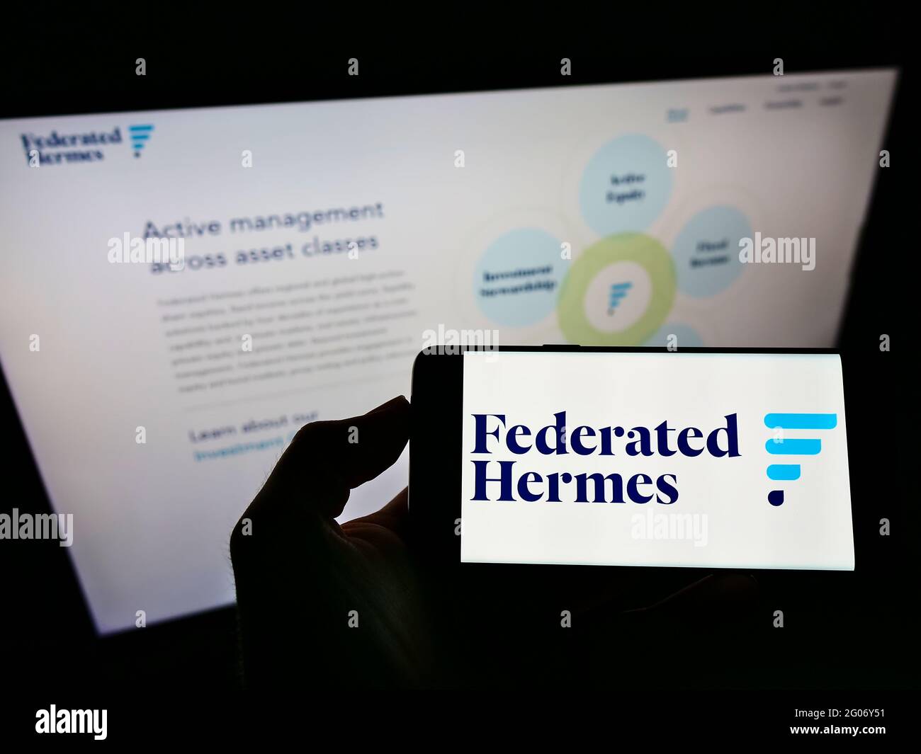 Person holding smartphone with logo of American investment manager Federated  Hermes Inc. on screen in front of webpage. Focus on phone display Stock  Photo - Alamy