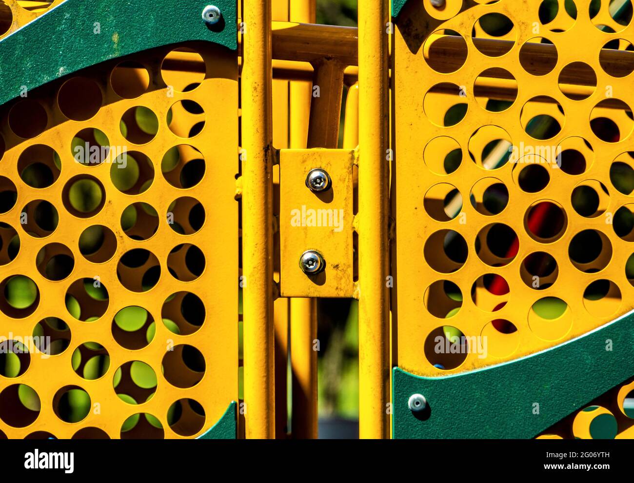 Brightly colored metal posts, part of equipment at a children’s ...