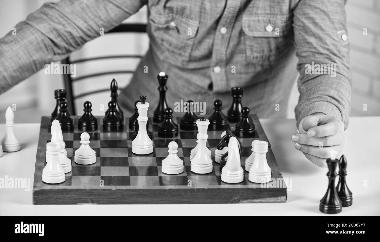 Intellectual hobby. Figures on wooden chess board. Thinking about next step. Strategy concept. School teacher. Board game. Playing chess. Development Stock Photo